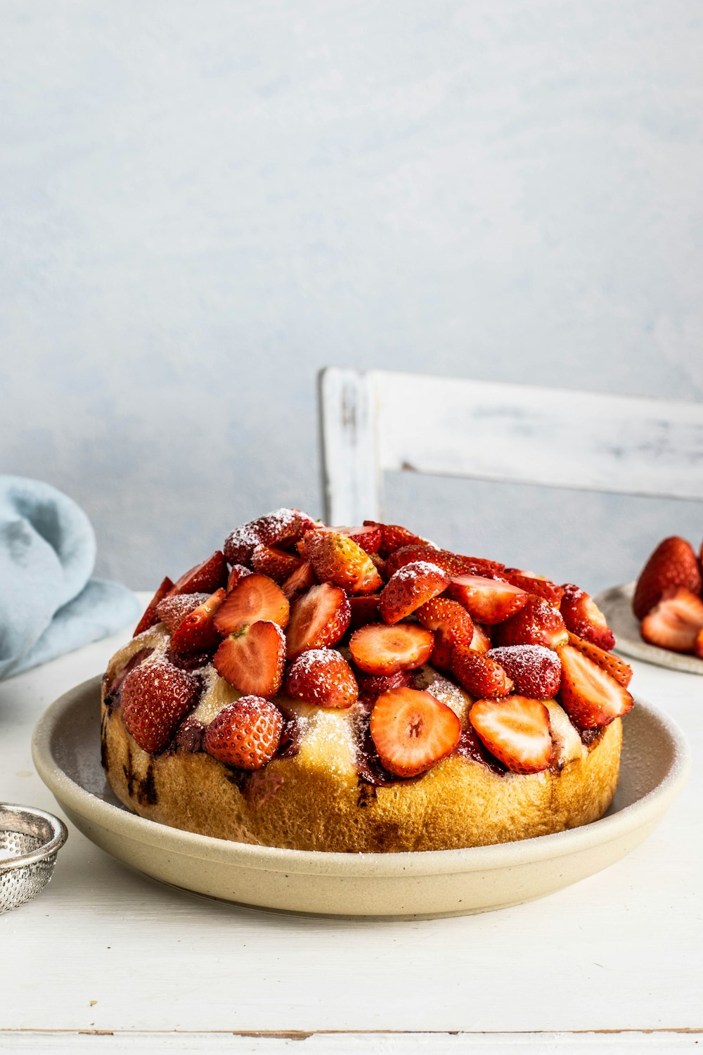 Golden cake topped with fresh strawberries